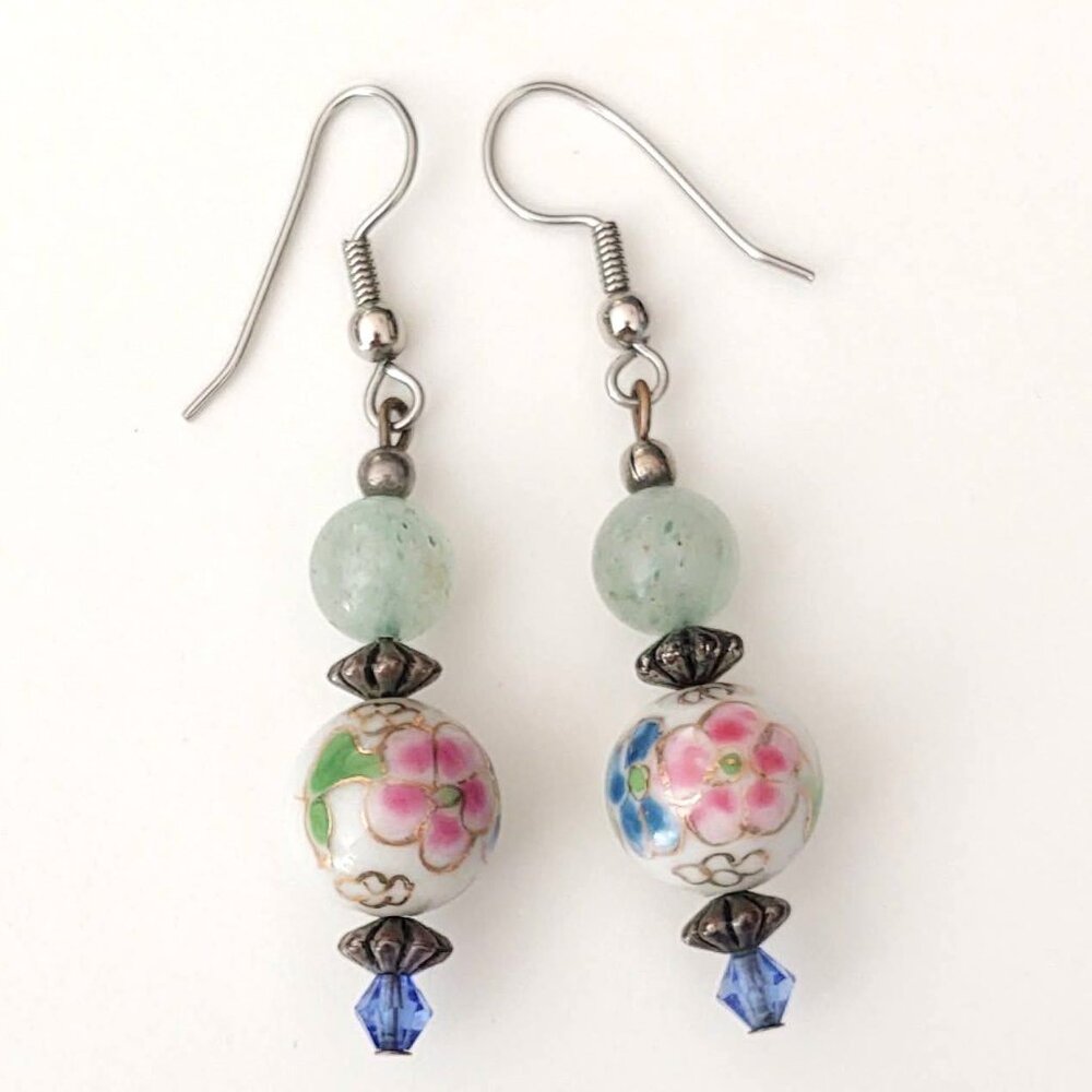 Floral painted ceramic beaded earrings with green and blue bead accents